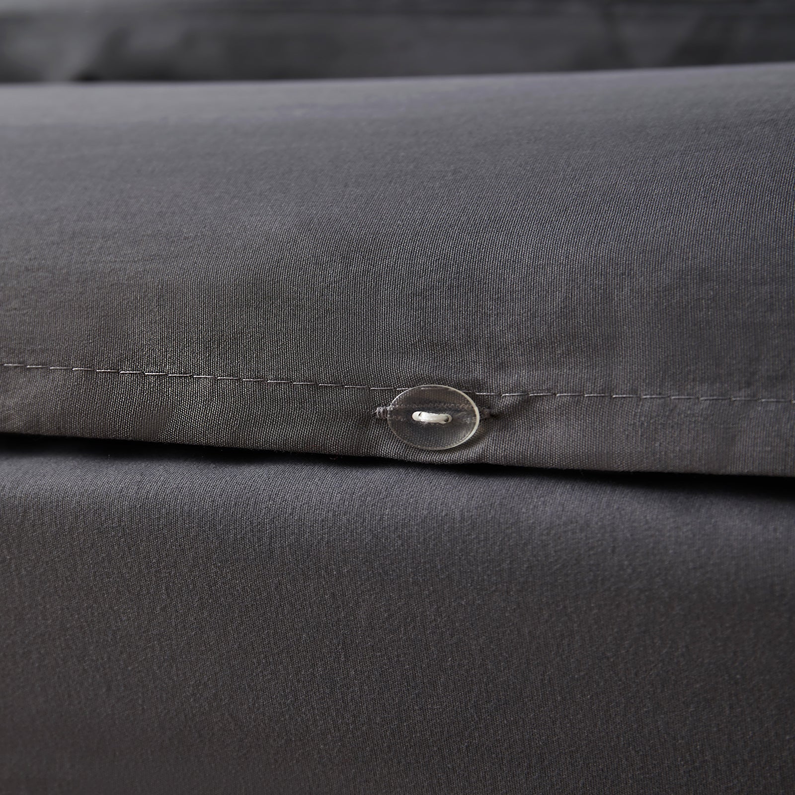 Duvet cover with secure button closure designed to keep the duvet neatly in place all night.